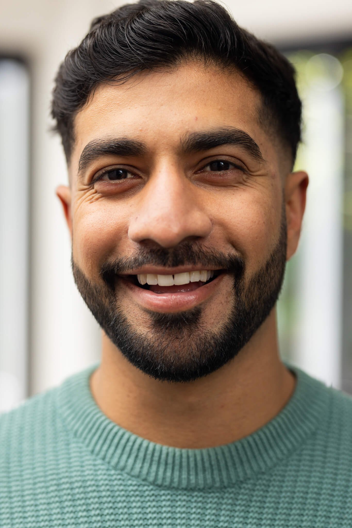 smiling young indian man in casual sweater looking 2025 04 05 00 22 18 utc