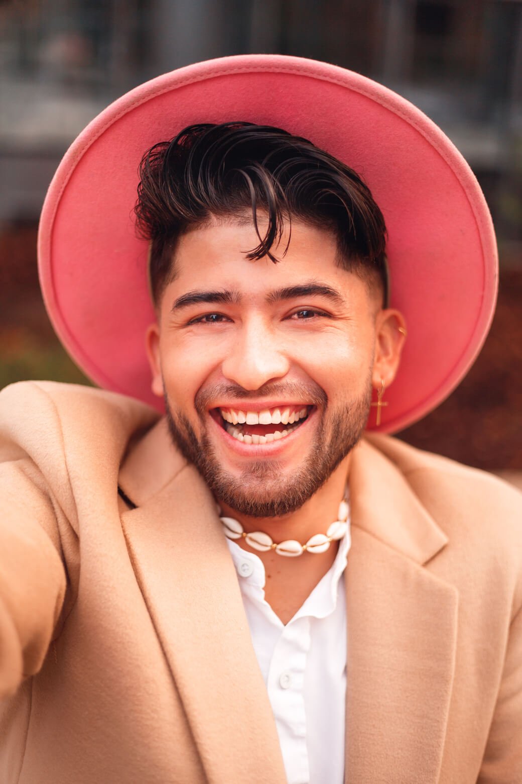 young hispanic man taking selfie in modern outdoor 2025 01 07 23 20 17 utc